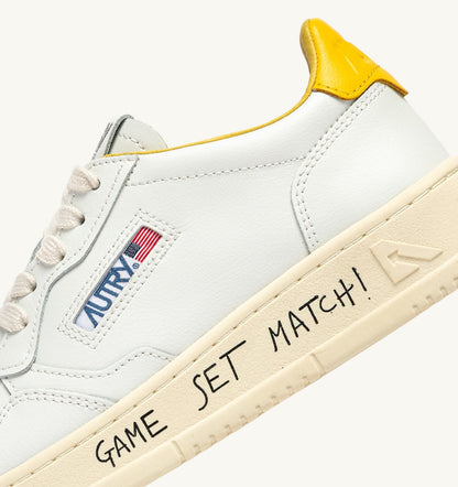 Man MEDALIST LOW SNEAKERS IN WHITE AND SLICKER LEATHER WITH LETTERING